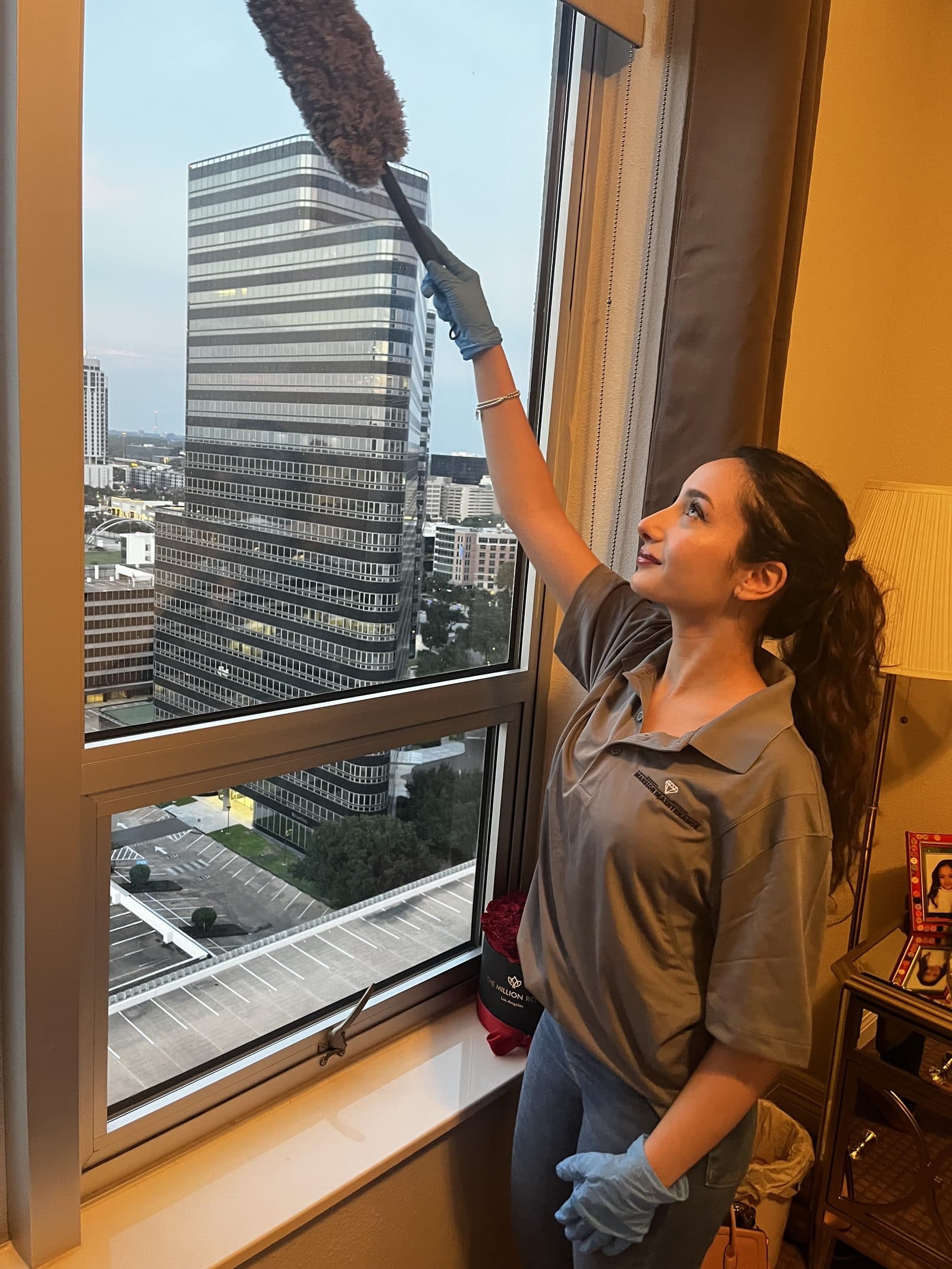High-rise window cleaning with the Houston skyline outside